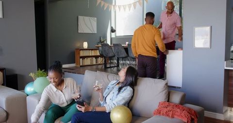 Diverse Friends Celebrating Birthday Party in Cozy Living Room
