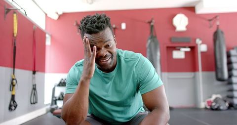 Fit African American Man Smiling Relaxing After Workout