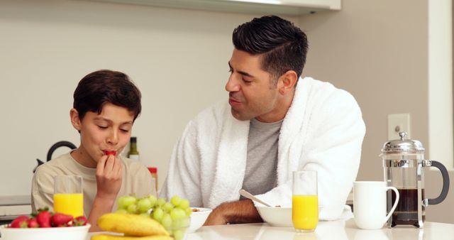 Father and Son Having Breakfast at Home - Download Free Stock Images Pikwizard.com