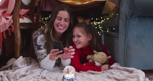 Mother and Daughter Enjoying Cozy Time Under Blanket Fort - Download Free Stock Images Pikwizard.com