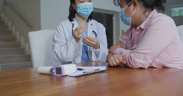 Female Doctor Preparing Vaccine for Patient Consultation - Download Free Stock Images Pikwizard.com