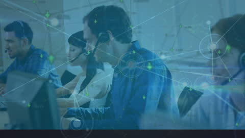 Customer Service Representatives Analyzing Digital Data in Modern Office