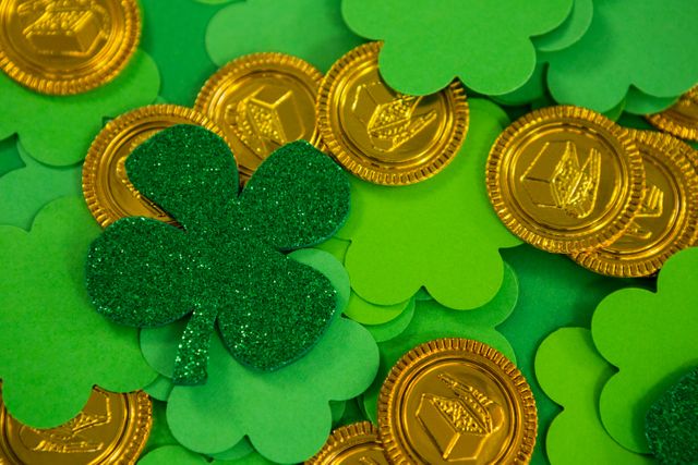 St Patricks Day shamrocks and gold chocolate coin - Download Free Stock Photos Pikwizard.com