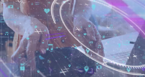 Hands with Holographic Digital Icons Overlay in Futuristic Setting