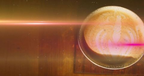 Overhead Latte Showing Rosetta Foam Art on Wooden Table with Pink Lens Flare and Copy Space