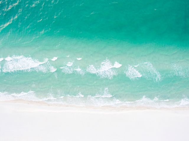 Aerial View of Pristine Sandy Beach and Turquoise Ocean Waves - Download Free Stock Photos Pikwizard.com