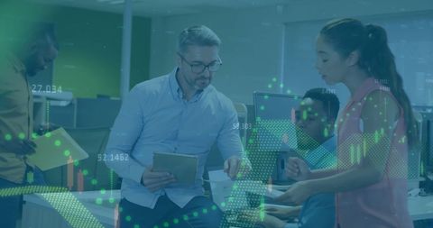 Mixed business team analyzing financial data in modern office