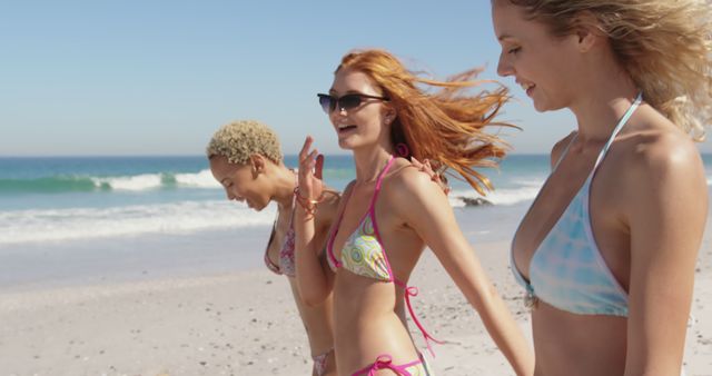 Three Young Women Walking on Sunny Beach in Swimsuits - Download Free Stock Images Pikwizard.com