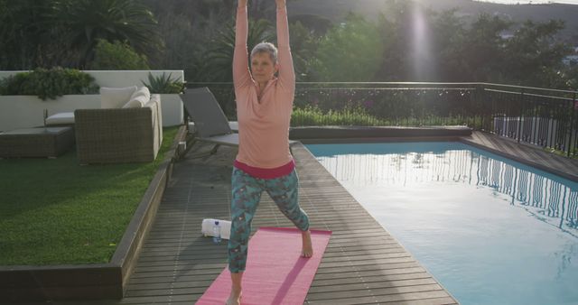 Senior Woman Practicing Yoga Outdoors Poses by Poolside - Download Free Stock Images Pikwizard.com