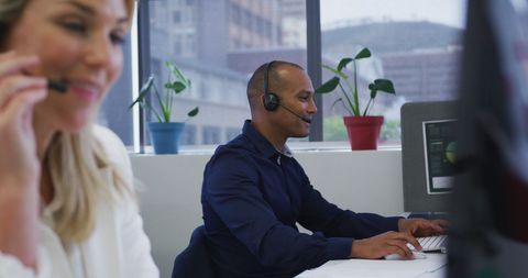 Business Professionals Communicating via Headsets in Modern Office - Download Free Stock Images Pikwizard.com