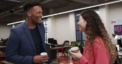 Colleagues Sharing a Coffee Break in Modern Office
