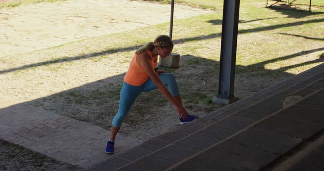 Woman Stretching Outdoors Near Stairs in Bright Workout Clothes - Download Free Stock Images Pikwizard.com