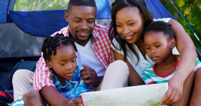 Happy African American Family Camping and Reading Map Outdoors - Download Free Stock Images Pikwizard.com