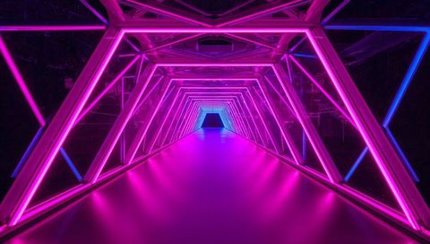 Glowing Neon Triangles Forming Futuristic Magenta and Blue Reflective Corridor