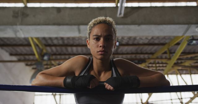 Female Boxer Leaning on Ring Corner Inside Gym - Download Free Stock Images Pikwizard.com