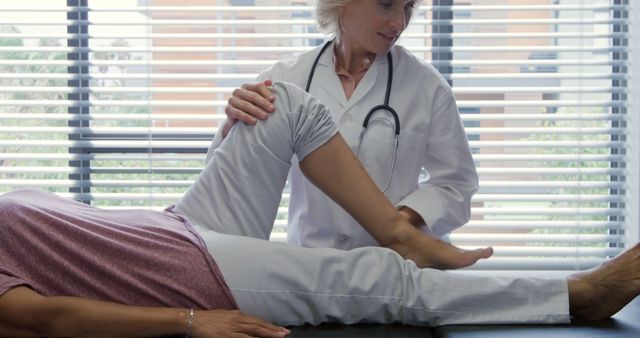 Doctor Performing Leg Examination on Patient in Clinic - Download Free Stock Images Pikwizard.com