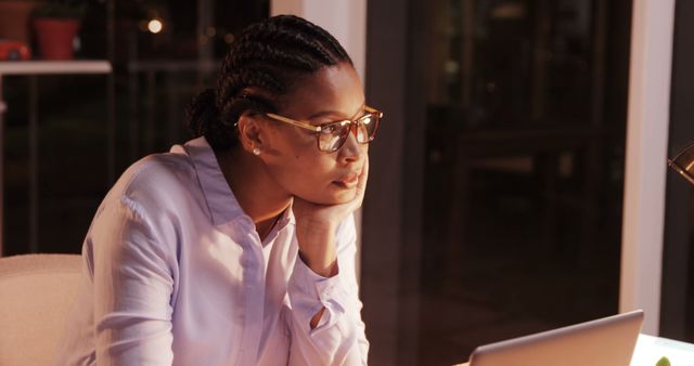 Focused Woman Working Late at Night in Office - Download Free Stock Images Pikwizard.com