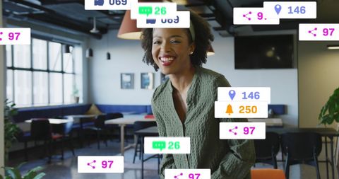 Smiling African American Woman with Social Media Icons in Office