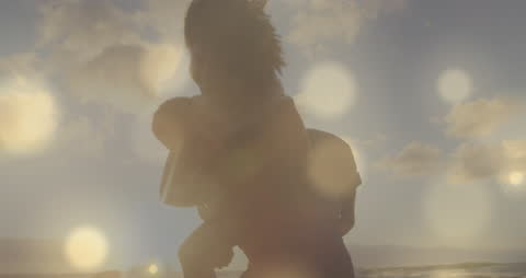 Glowing Spots Animation Over Diverse Couple Embracing on Beach