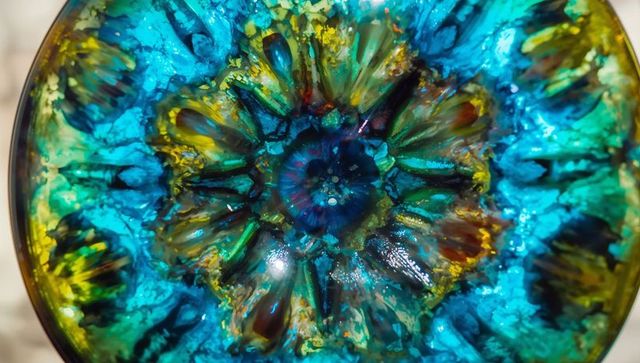 Vibrant radial pattern in blue teal palette with gold accents