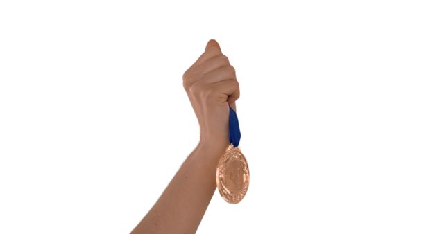 A Caucasian hand holds a bronze medal, symbolizing competitive achievement. - Download Free Stock Photos Pikwizard.com
