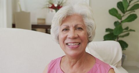 Happy Elderly Woman Smiling at Home Relaxing Indoors