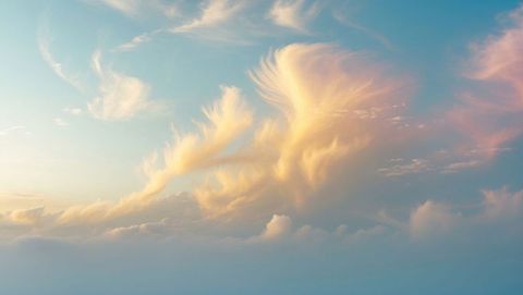 Wispy cirrus clouds in serene pastel sky