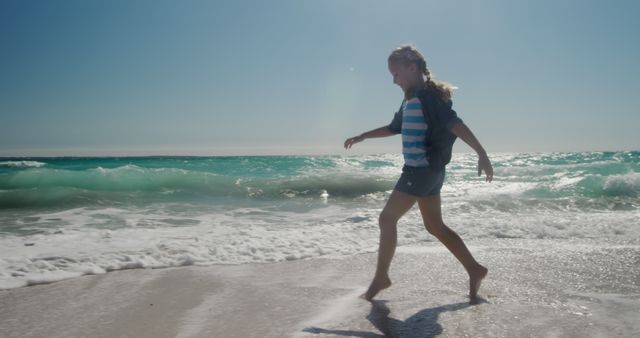 Happy Girl Walking along Sunny Beach - Download Free Stock Images Pikwizard.com