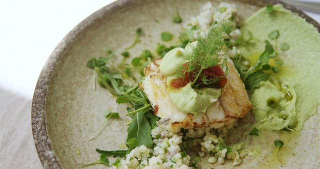 Gourmet Dish of Grilled Fish with Couscous, Greens, Avocado Cream - Download Free Stock Images Pikwizard.com