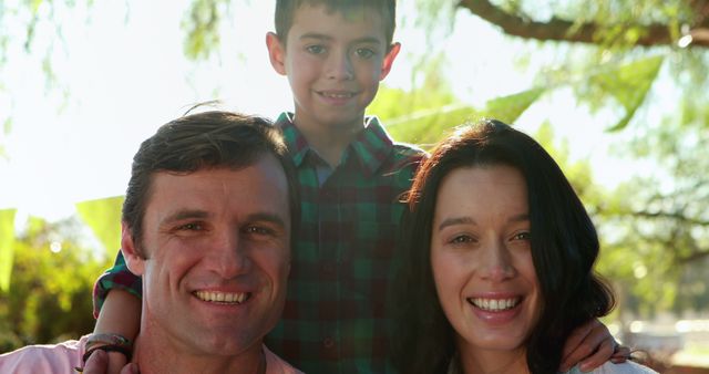 Happy Family Posing Outdoors in Sunny Garden - Download Free Stock Images Pikwizard.com