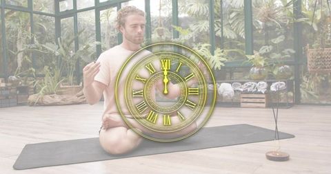 Man Meditating on Mat in Greenhouse with Clock Overlay and Incense Smoke
