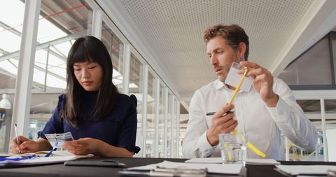 Business Conference Preparation with Name Badges by Colleagues