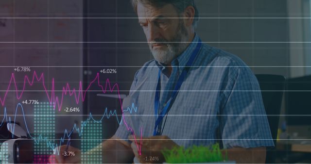 Serious Businessman Analyzing Financial Charts in Modern Office - Download Free Stock Images Pikwizard.com