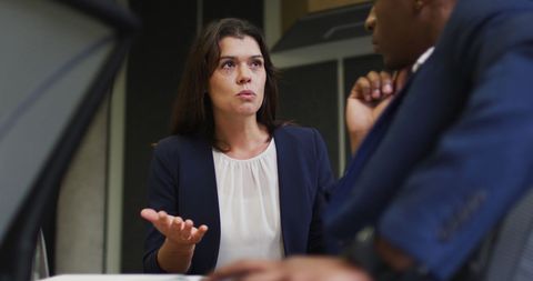 Business Professionals Engaged in Intense Office Discussion