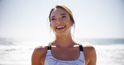 Smiling Woman Enjoying Sunny Day at the Beach