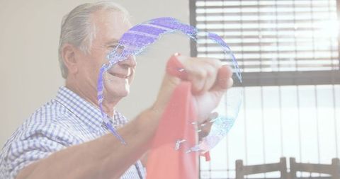 Senior exercising with resistance band at home, globe overlay for active aging