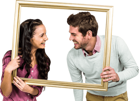 Smiling couple holding transparent frame