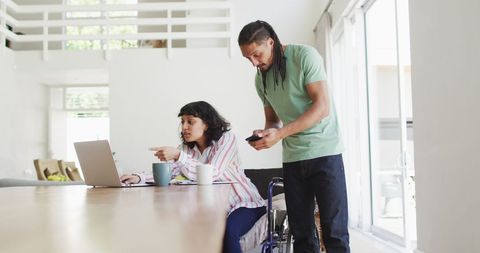 Inclusive Couple Using Technology at Home