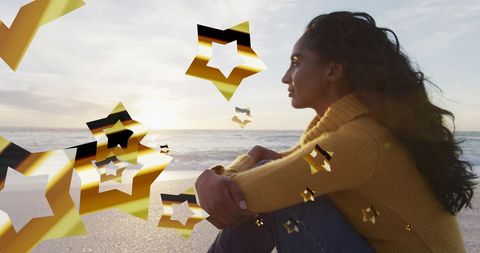 woman relaxing at beach with digital stars overlay - Download Free Stock Images Pikwizard.com