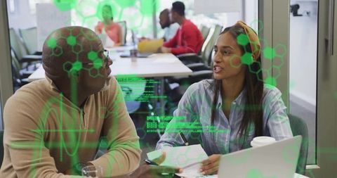 Diverse Team Collaborating in Tech Office with Virtual Overlay