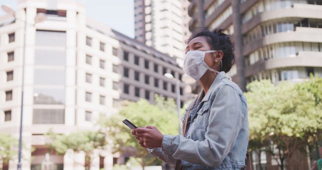 Young Woman in Mask Using Smartphone Outdoors in Urban Area - Download Free Stock Images Pikwizard.com