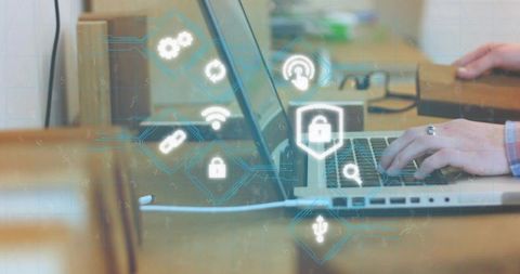 Typing hands protecting laptop with glowing cybersecurity icons, padlock, fingerprint, wifi