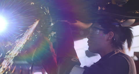 Welder Working with Sparks in Workshop