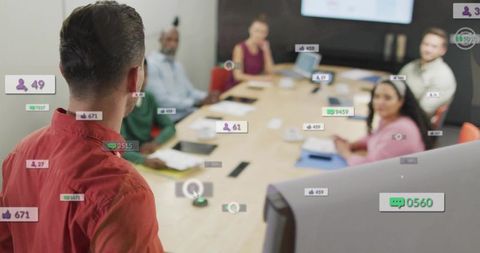 Leader presenting with augmented reality metrics to team in modern boardroom meeting