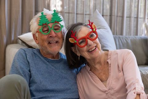 Senior Couple Celebrating Holidays with Festive Glasses