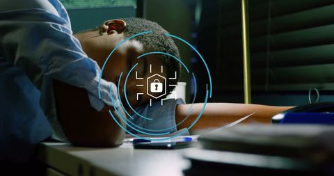 Exhausted businesswoman sleeping at office desk with security overlay