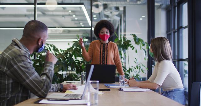 Office Team Brainstorming with Protective Masks in Modern Workplace - Download Free Stock Images Pikwizard.com