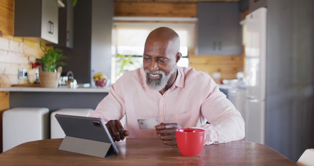 Mature Man Shopping Online in Cozy Kitchen - Download Free Stock Images Pikwizard.com