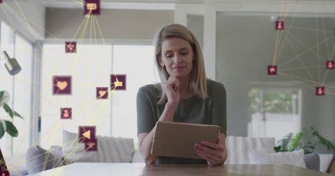 Woman Engaging with Social Media Network on Tablet at Home