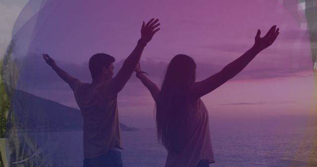 Carefree couple enjoying sunset at beach with open arms in silhouette - Download Free Stock Images Pikwizard.com